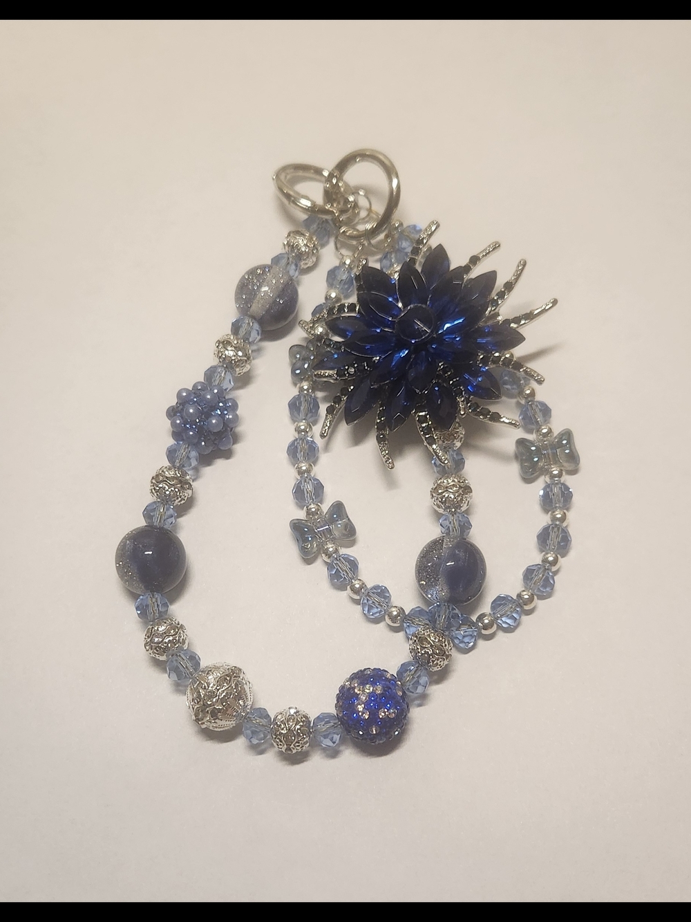 Handcrafted Blue Floral Statement Bracelet with Beaded Accents Bag/Phone Charms